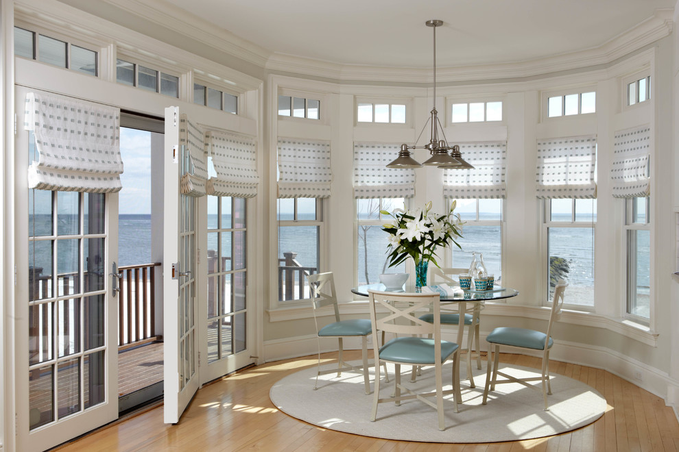 Inspiration for a world-inspired dining room in Atlanta with medium hardwood flooring.