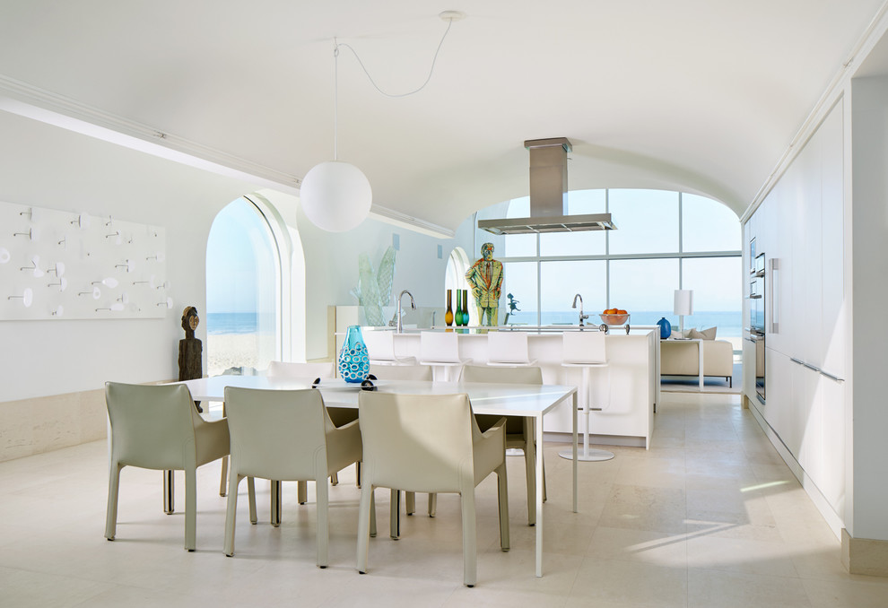 This is an example of a modern kitchen/dining room in Los Angeles with white walls.