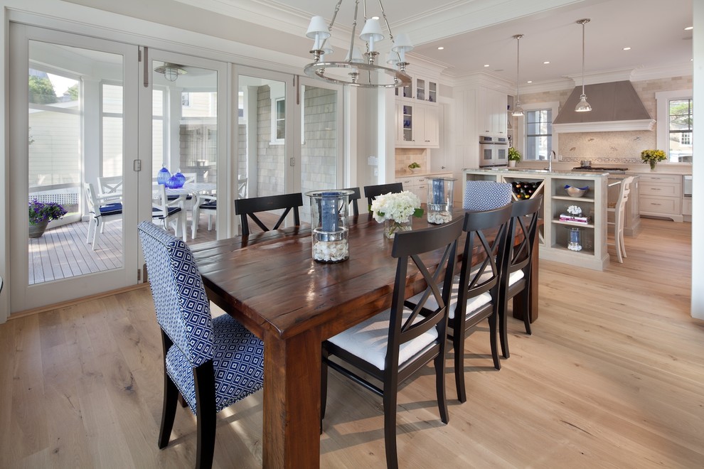 This is an example of a large beach style kitchen/dining room in DC Metro with grey walls, light hardwood flooring and no fireplace.