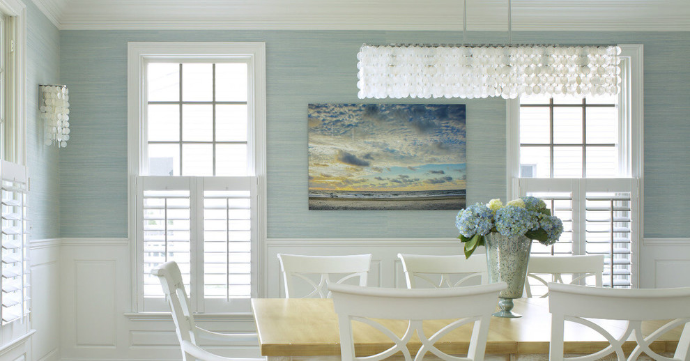 This is an example of a medium sized beach style dining room in New York.