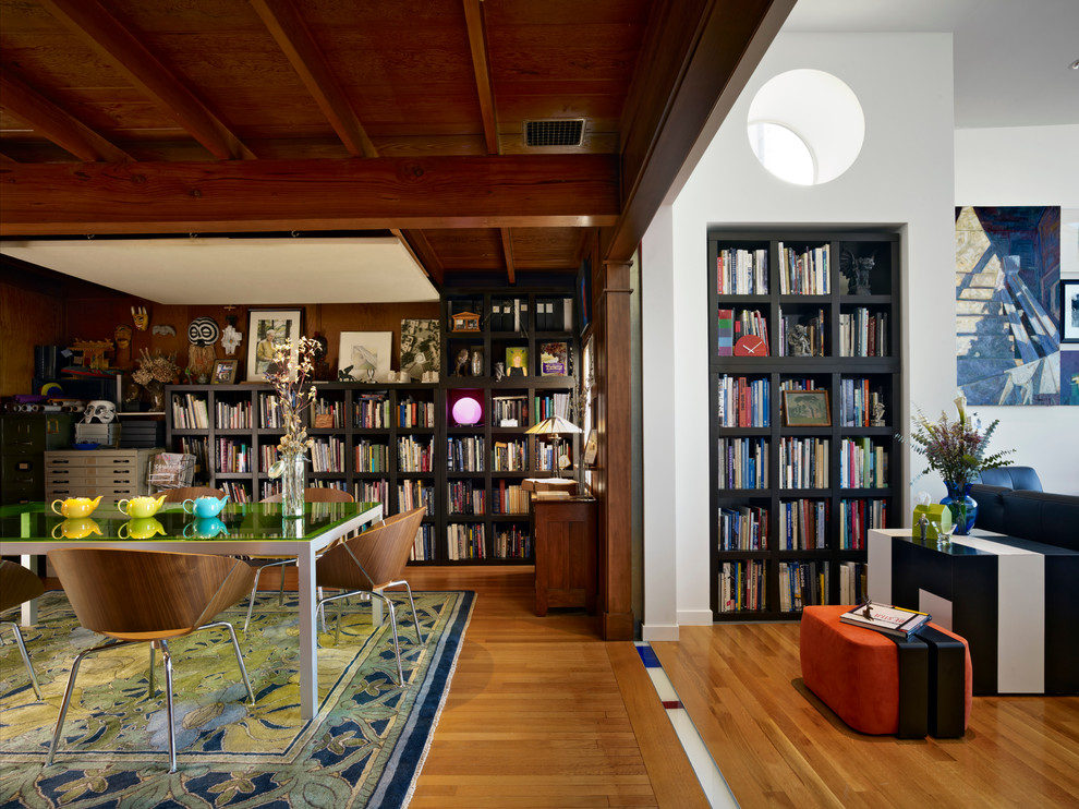Design ideas for a medium sized bohemian open plan dining room in San Francisco with medium hardwood flooring.