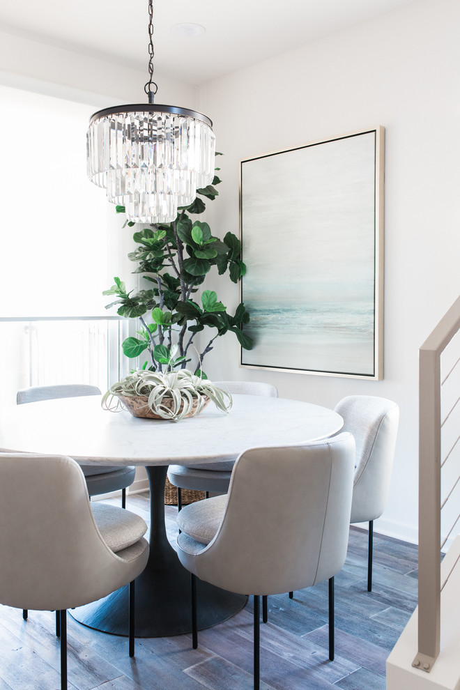 Inspiration for a coastal brown floor dining room remodel in Orange County with beige walls