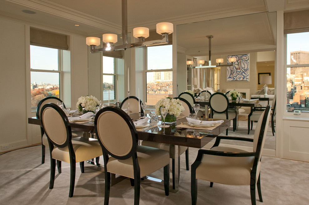 Inspiration for a medium sized traditional enclosed dining room in Boston with white walls and carpet.