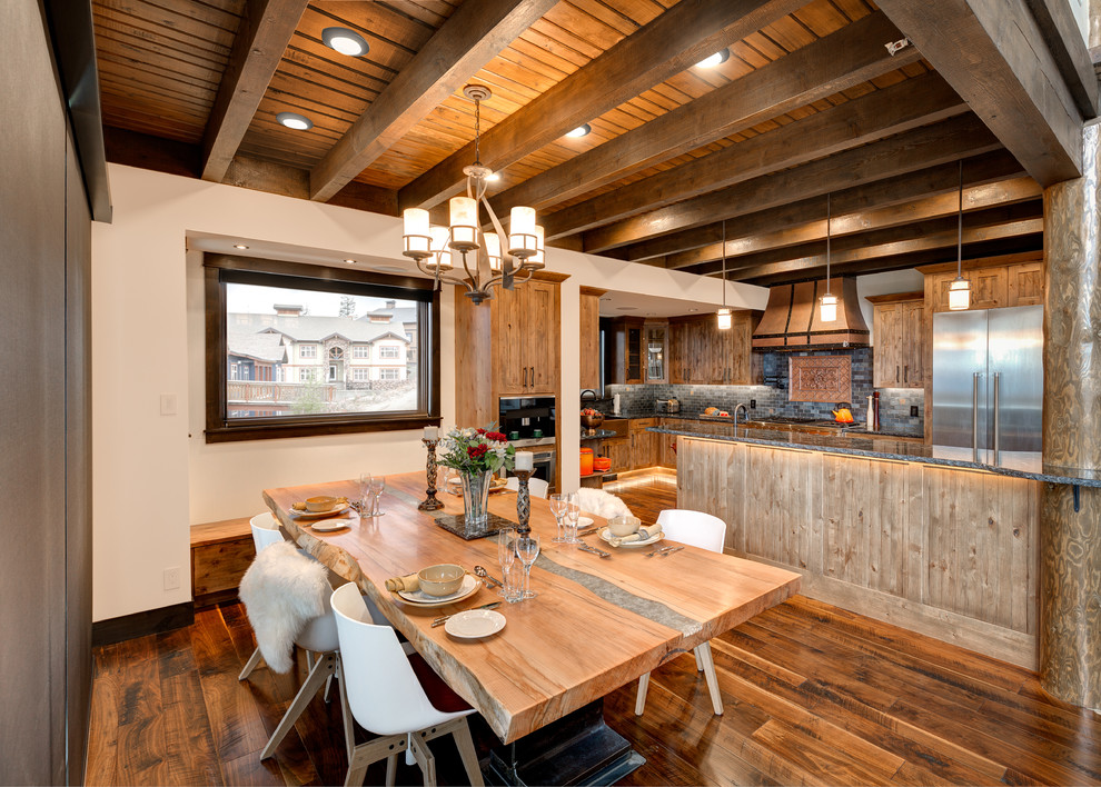 Inspiration for a rustic kitchen/dining room in Vancouver with white walls and medium hardwood flooring.