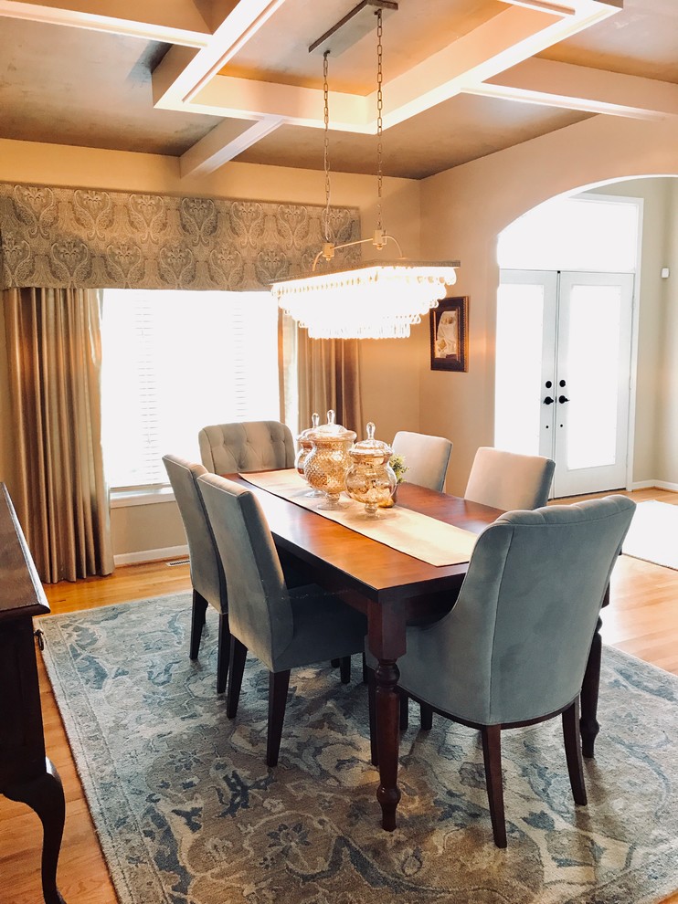 This is an example of a medium sized traditional enclosed dining room in Other with beige walls, light hardwood flooring, no fireplace and brown floors.