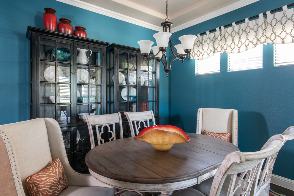 Enclosed dining room - mid-sized rustic dark wood floor and brown floor enclosed dining room idea in Dallas with blue walls and no fireplace