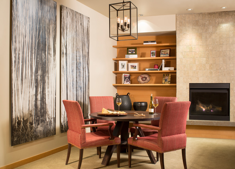 Design ideas for a contemporary dining room in Denver with a tiled fireplace surround.