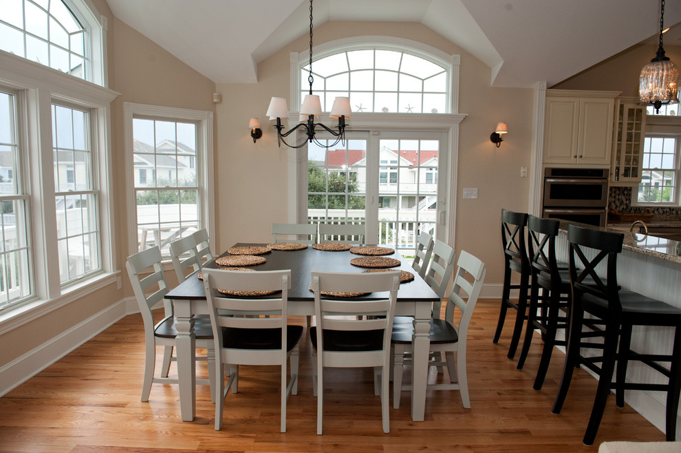 Design ideas for a medium sized nautical open plan dining room in Other with beige walls, light hardwood flooring and no fireplace.