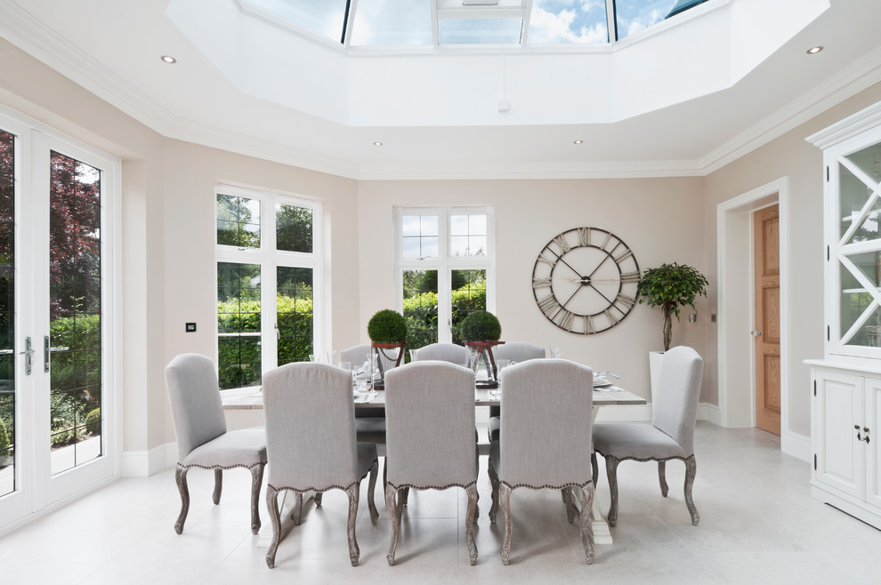 Photo of a modern enclosed dining room in Berkshire with beige walls.