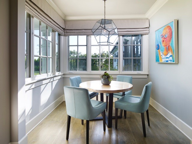 Enclosed dining room - contemporary light wood floor enclosed dining room idea in Los Angeles with gray walls