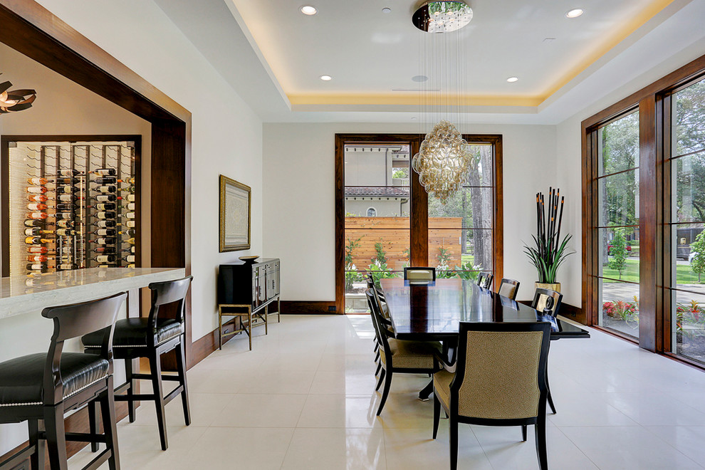 Large trendy marble floor and beige floor enclosed dining room photo in Houston with beige walls and no fireplace