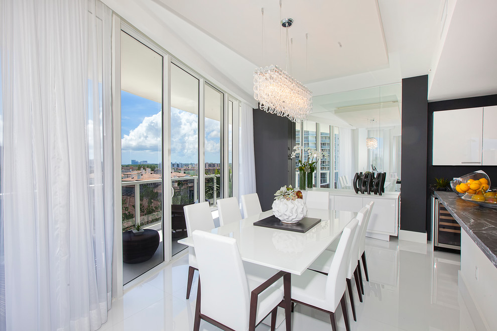 Contemporary kitchen/dining room in Miami with black walls and no fireplace.