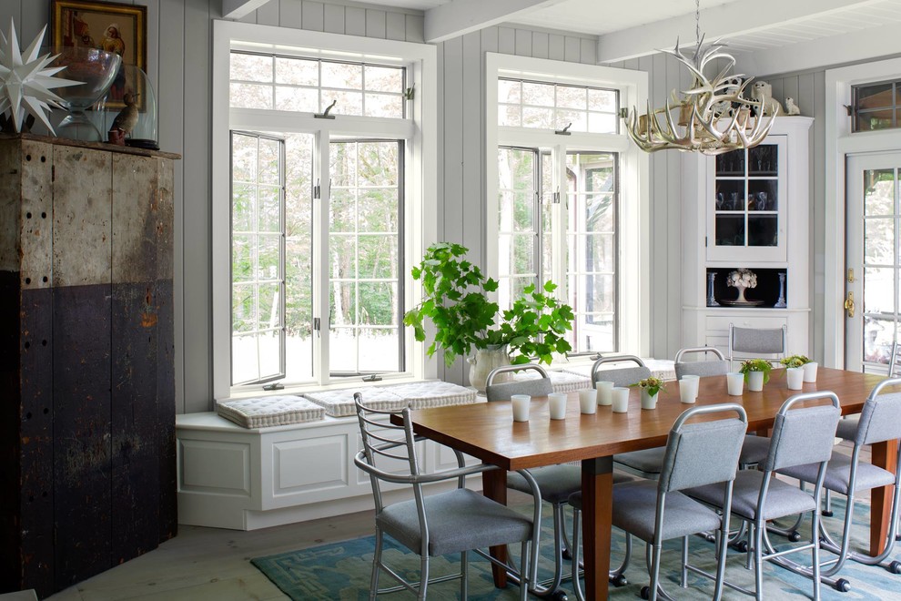 Inspiration for a farmhouse dining room in Los Angeles with grey walls, light hardwood flooring and beige floors.