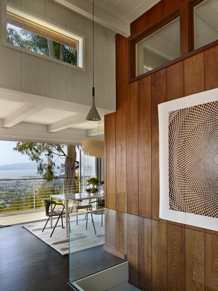 Mid-century modern dark wood floor dining room photo in San Francisco