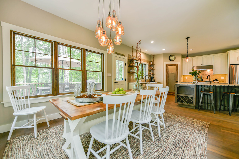 Farmhouse medium tone wood floor kitchen/dining room combo photo in Portland Maine with beige walls