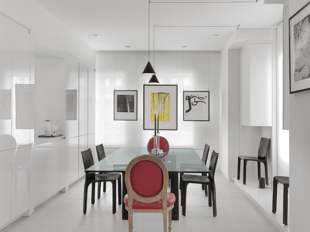 Idee per una sala da pranzo minimal chiusa e di medie dimensioni con pareti bianche, pavimento in gres porcellanato e pavimento bianco