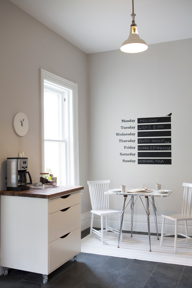 Example of a small trendy slate floor dining room design in Toronto with gray walls