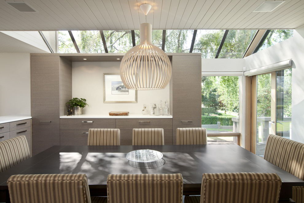 Inspiration for a medium sized contemporary enclosed dining room in Vancouver with white walls.