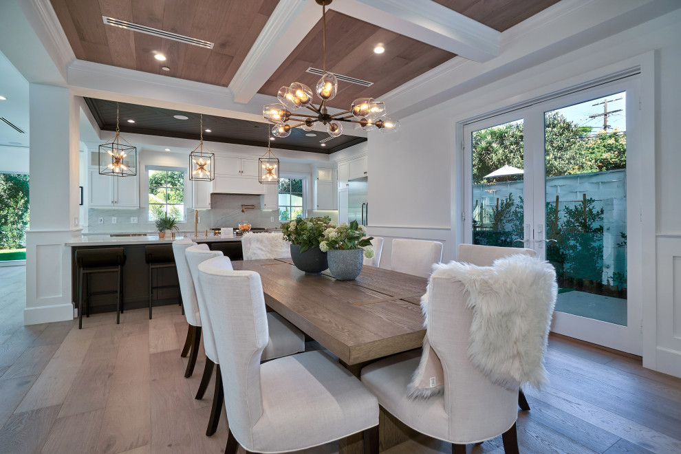 Inspiration for a contemporary medium tone wood floor, brown floor, wood ceiling and wainscoting dining room remodel in Los Angeles with white walls