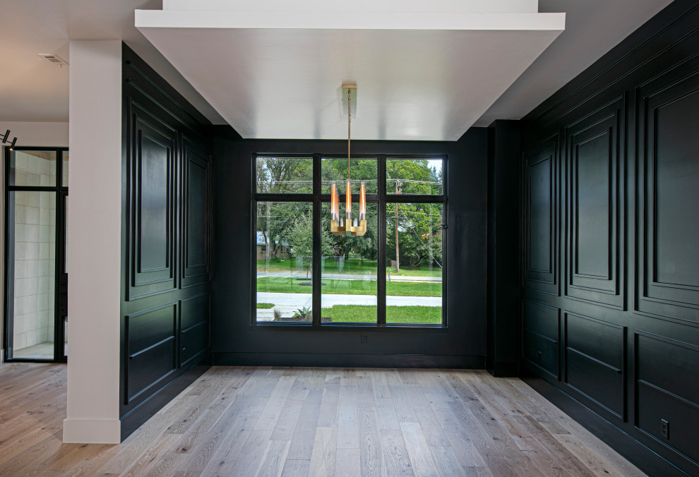 This is an example of a large contemporary kitchen/dining room in Dallas with black walls.