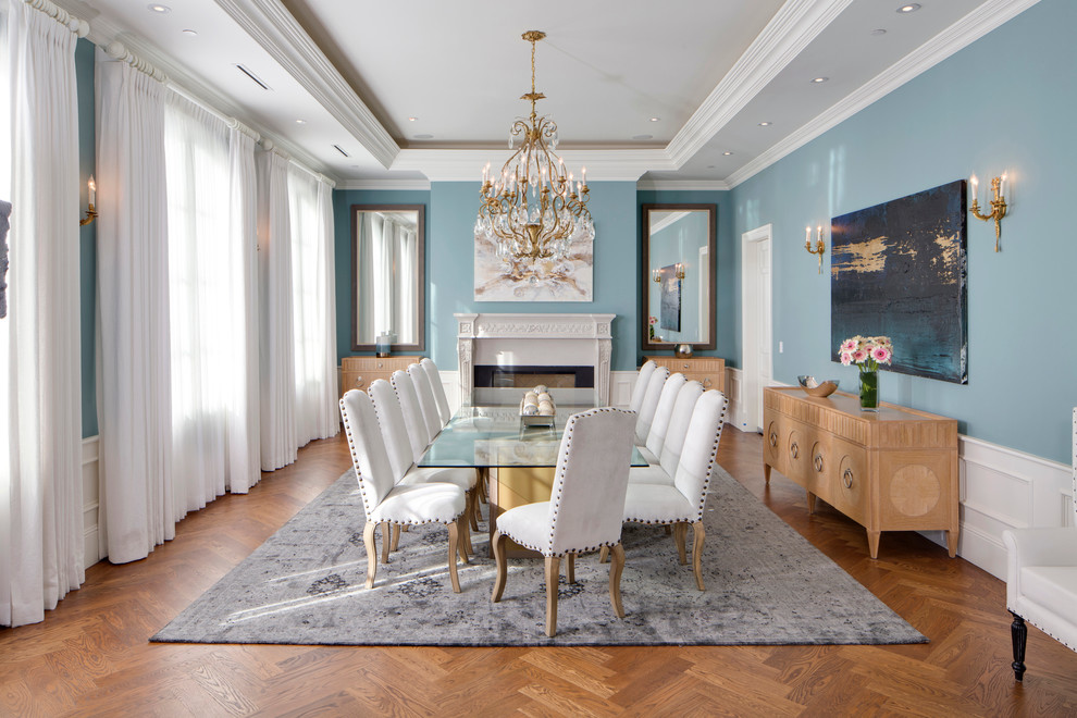 Traditional enclosed dining room in Los Angeles with blue walls and medium hardwood flooring.
