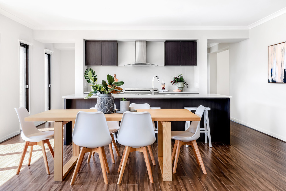 Mid-sized trendy light wood floor and brown floor kitchen/dining room combo photo in Melbourne with no fireplace and gray walls