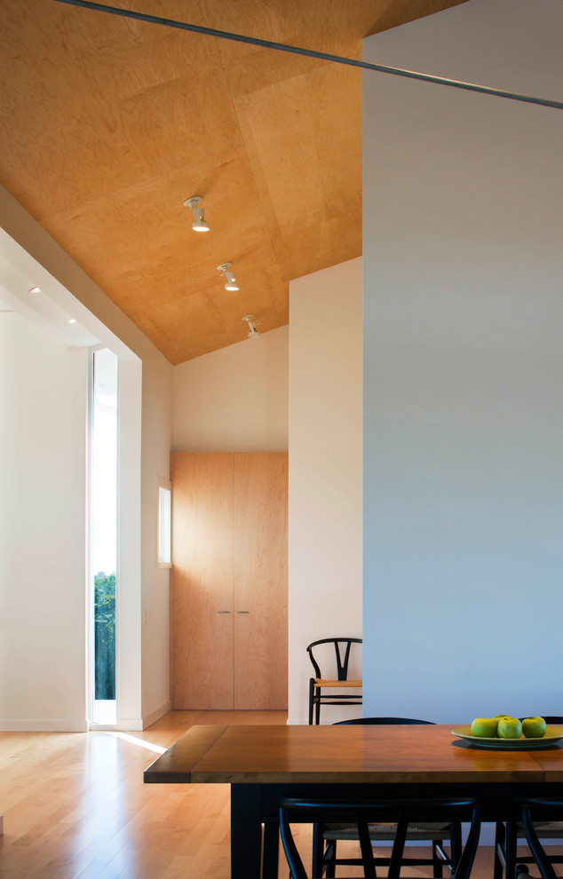 Minimalist dining room photo in Providence with white walls