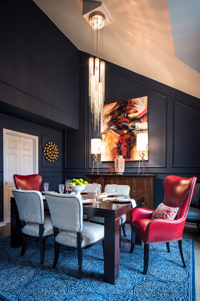 Classic dining room in Cincinnati with blue walls and feature lighting.