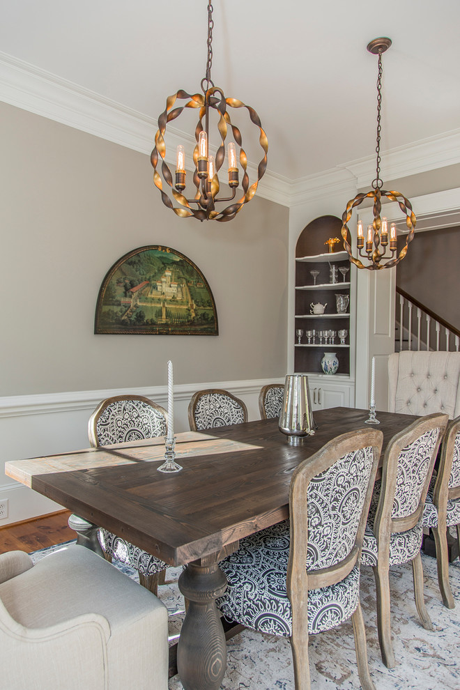 This is an example of a medium sized classic enclosed dining room in Other with grey walls, medium hardwood flooring, no fireplace and brown floors.