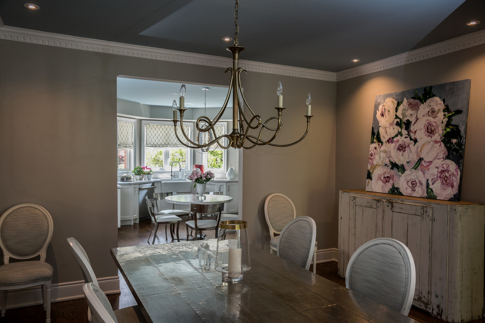 Photo of a traditional dining room in Toronto with grey walls and dark hardwood flooring.