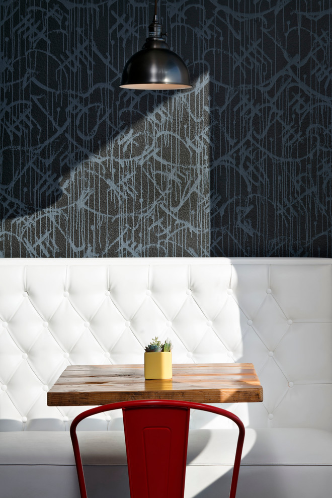 Inspiration for a medium sized urban dining room in San Francisco with black walls and no fireplace.