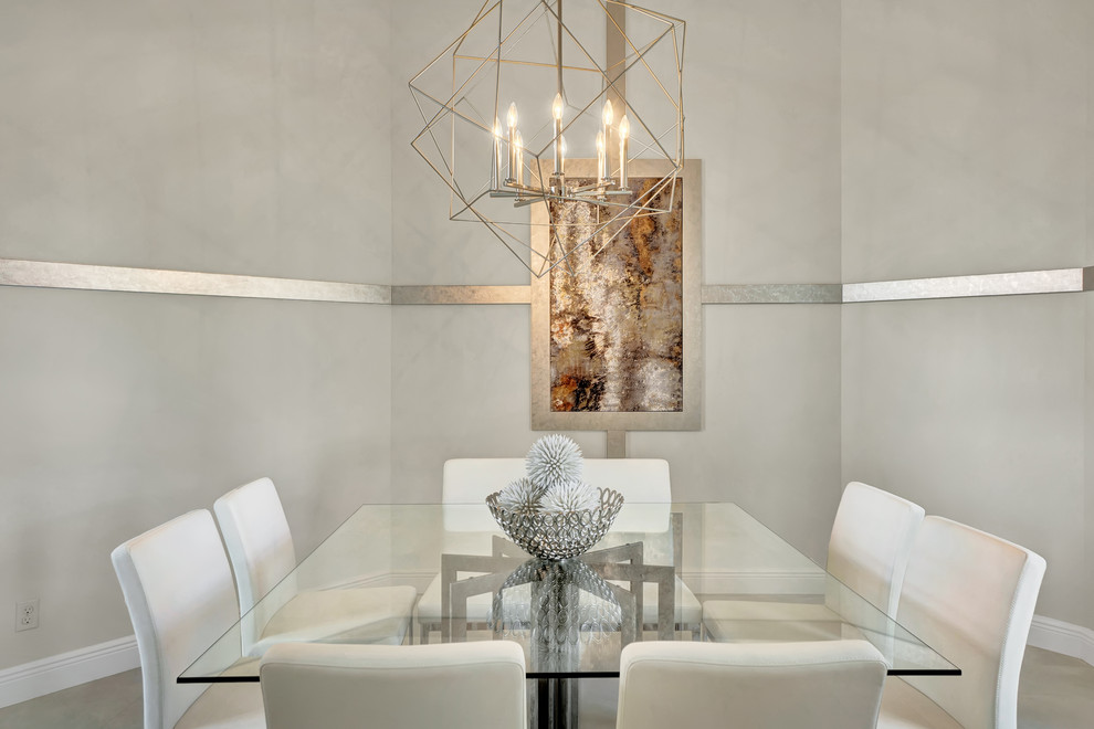 Exemple d'une salle à manger tendance fermée et de taille moyenne avec un mur blanc, un sol en carrelage de porcelaine et un sol gris.
