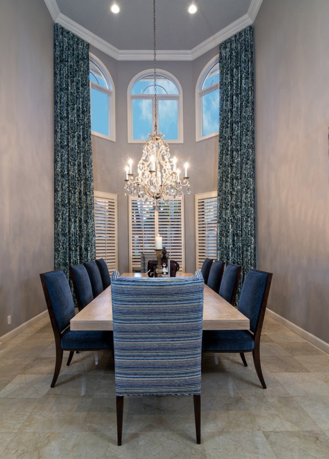 Inspiration for a mid-sized transitional marble floor dining room remodel in Miami with gray walls