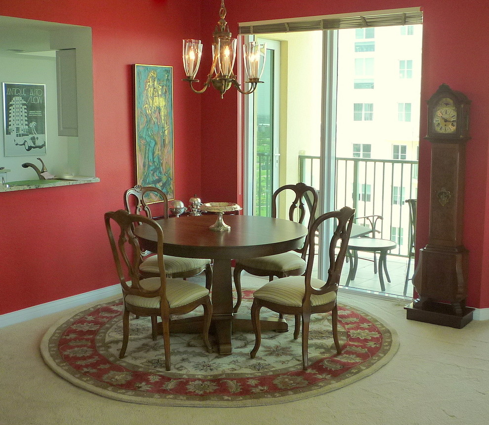 Example of a mid-sized eclectic carpeted great room design in Miami with red walls and no fireplace