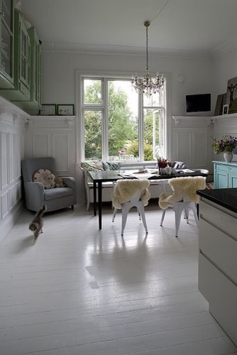 Example of an eclectic white floor dining room design in Other