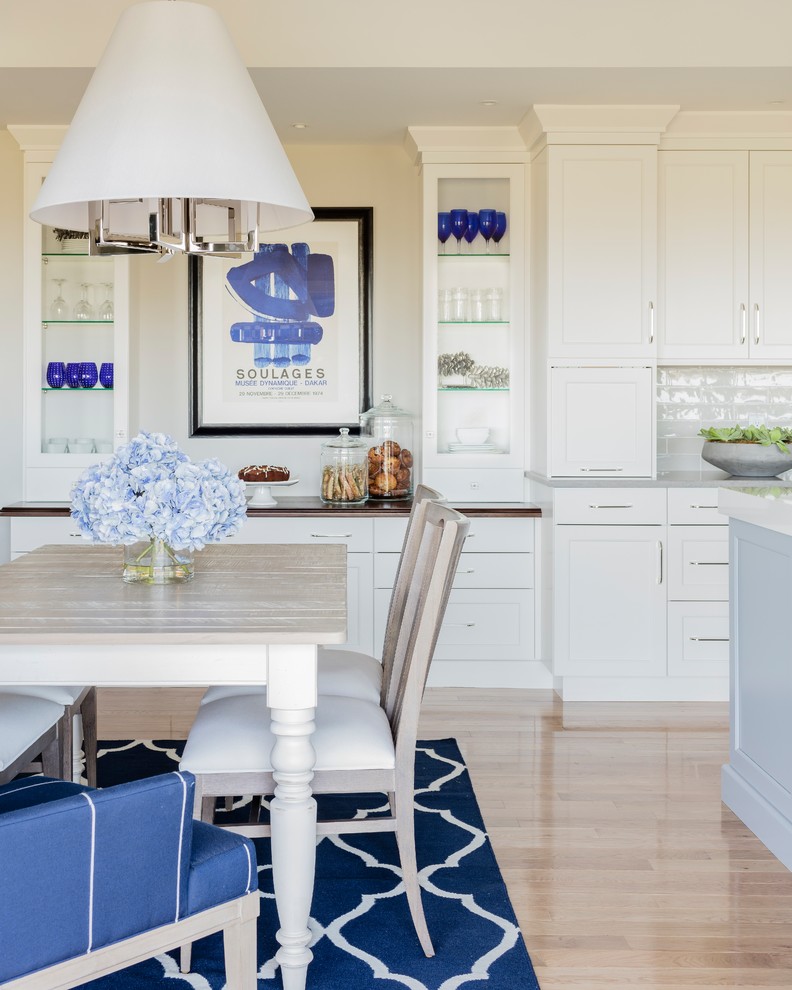 Inspiration for a classic open plan dining room in DC Metro with beige walls, light hardwood flooring and beige floors.