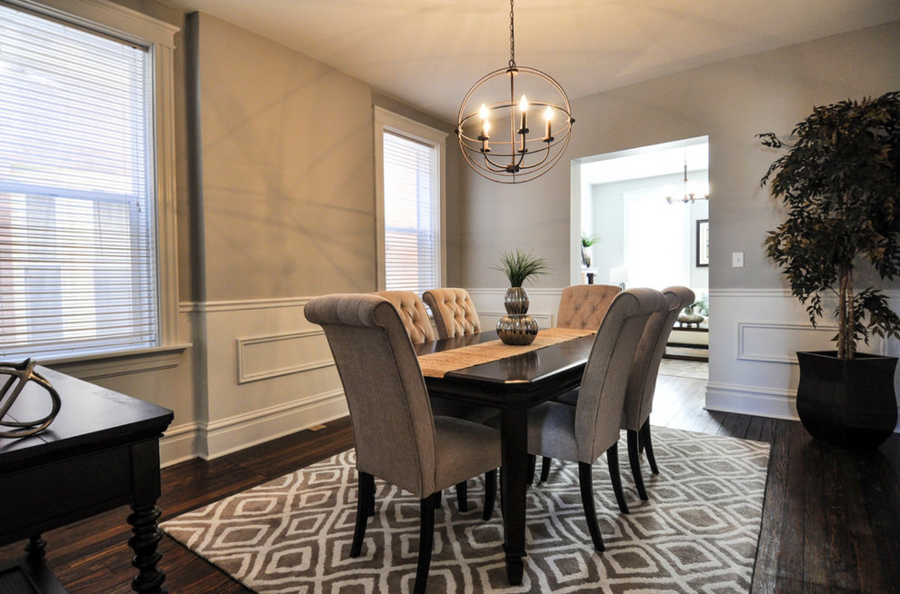 Inspiration for a medium sized classic enclosed dining room in St Louis with grey walls, medium hardwood flooring and no fireplace.