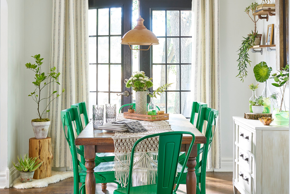 Example of a mid-sized cottage chic brown floor and dark wood floor dining room design in Other with gray walls and no fireplace