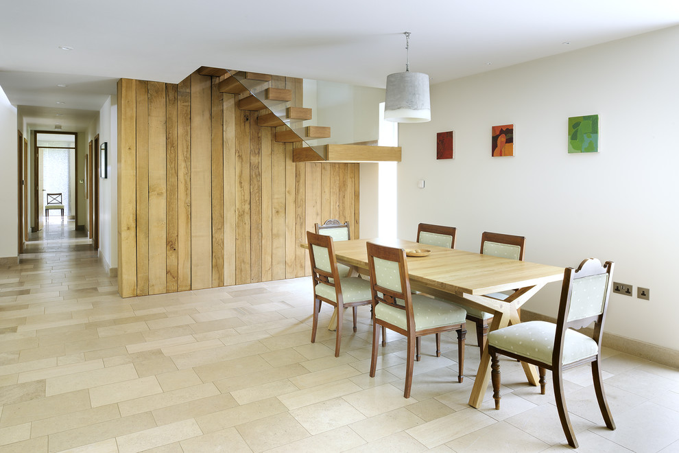 Inspiration for a contemporary dining room in Hampshire with white walls.