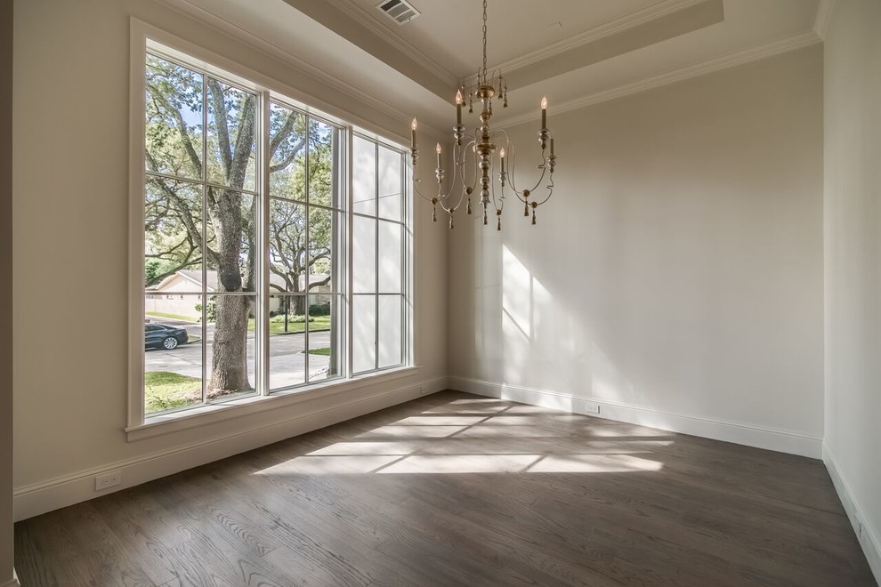 Medium sized classic enclosed dining room in Houston with beige walls and medium hardwood flooring.