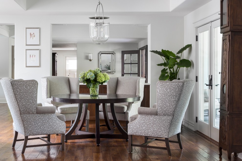 Inspiration for a medium sized traditional open plan dining room in San Francisco with no fireplace, brown floors, white walls and dark hardwood flooring.