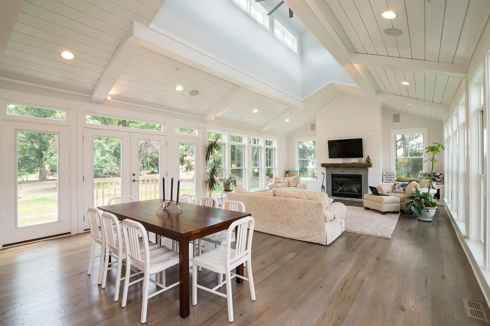 Photo of a large farmhouse dining room in Baltimore with white walls and medium hardwood flooring.