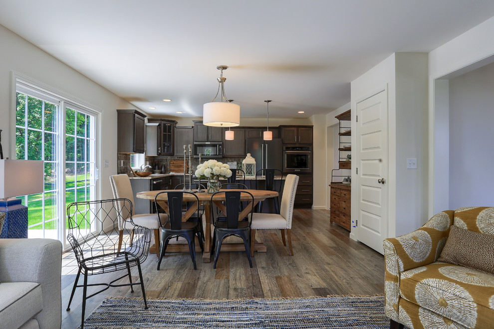 Inspiration for a medium sized classic open plan dining room in Other with medium hardwood flooring and brown floors.