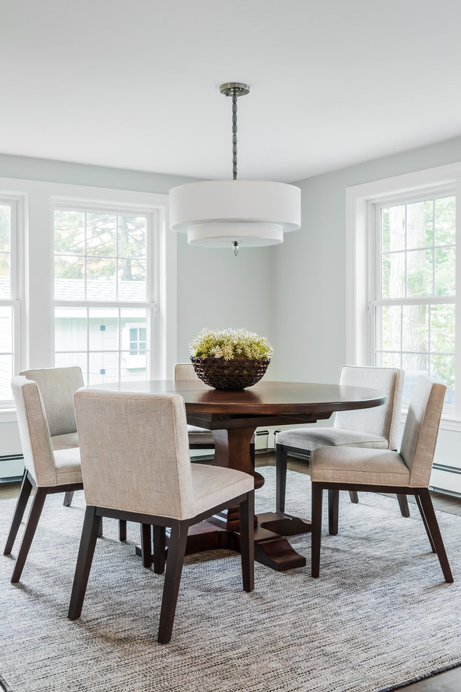 Design ideas for a large traditional enclosed dining room in Boston with grey walls, medium hardwood flooring, no fireplace and brown floors.