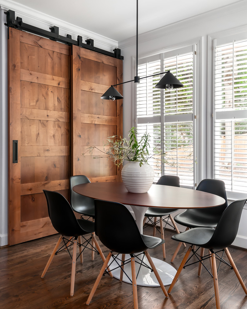 Example of a mid-sized transitional dark wood floor and brown floor kitchen/dining room combo design in Atlanta with white walls