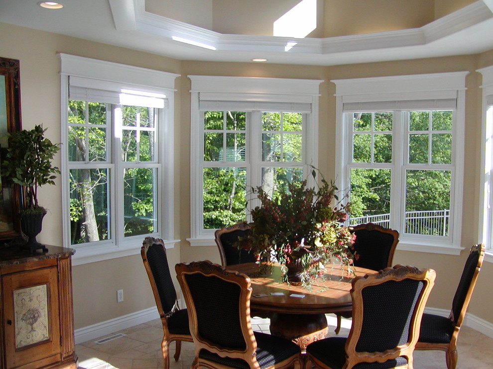 This is an example of a classic dining room in Grand Rapids with beige walls.