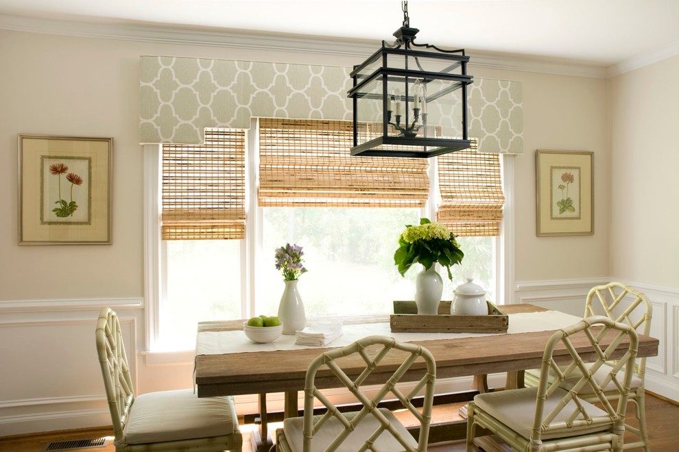 Elegant medium tone wood floor dining room photo in Wilmington with beige walls