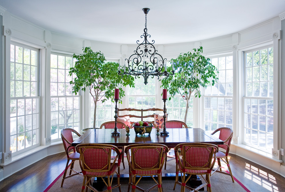 Inspiration for a traditional dining room in Other with dark hardwood flooring.