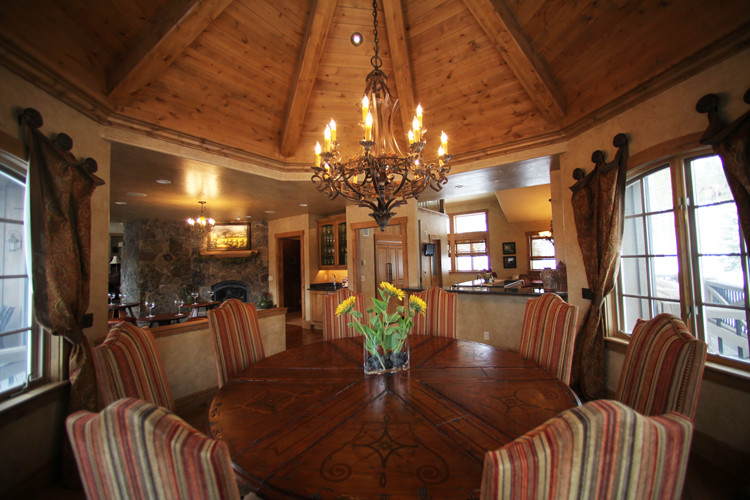 Example of a mountain style dining room design in Denver