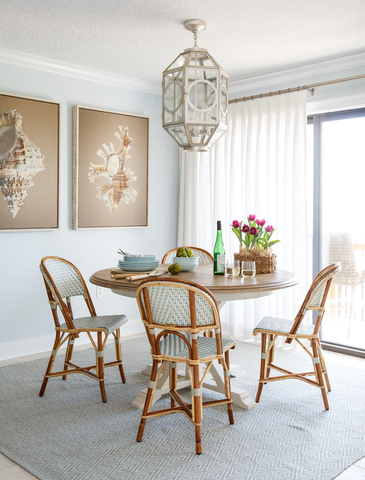 Inspiration for a coastal dining room remodel in Jacksonville with blue walls